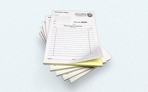 Two part carbonless forms padded into booklets.