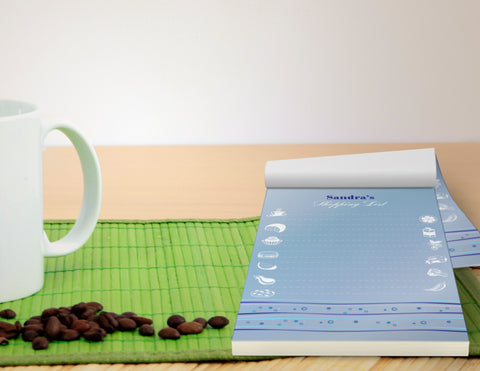 Full color printed notepad on table