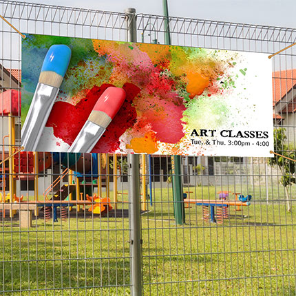Full color vinyl banner installed on fence.