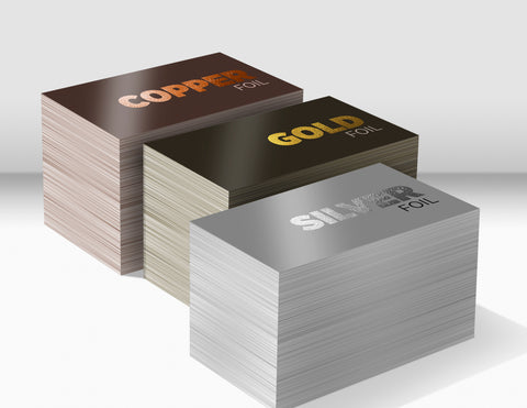 Stacks of business cards printed with foil 