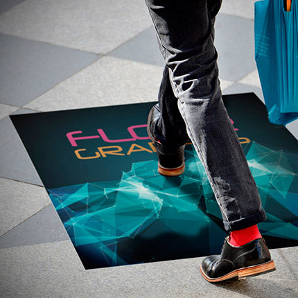 Person walking over full color printed large adhesive vinyl floor graphic.