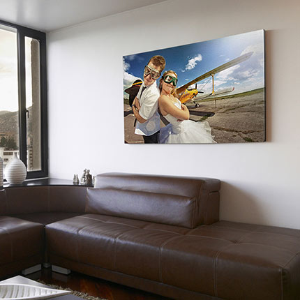 Mounted canvas print on living room wall