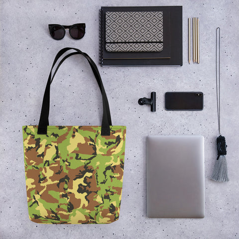 All-over printed tote bag with camo pattern surrounded by items.